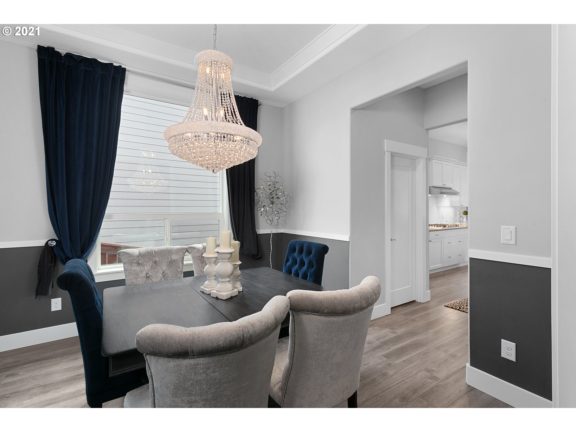 4701 South 19th Street Ridgefield, WA 98642 - Photo 5 of 32 a living room with furniture and a chandelier