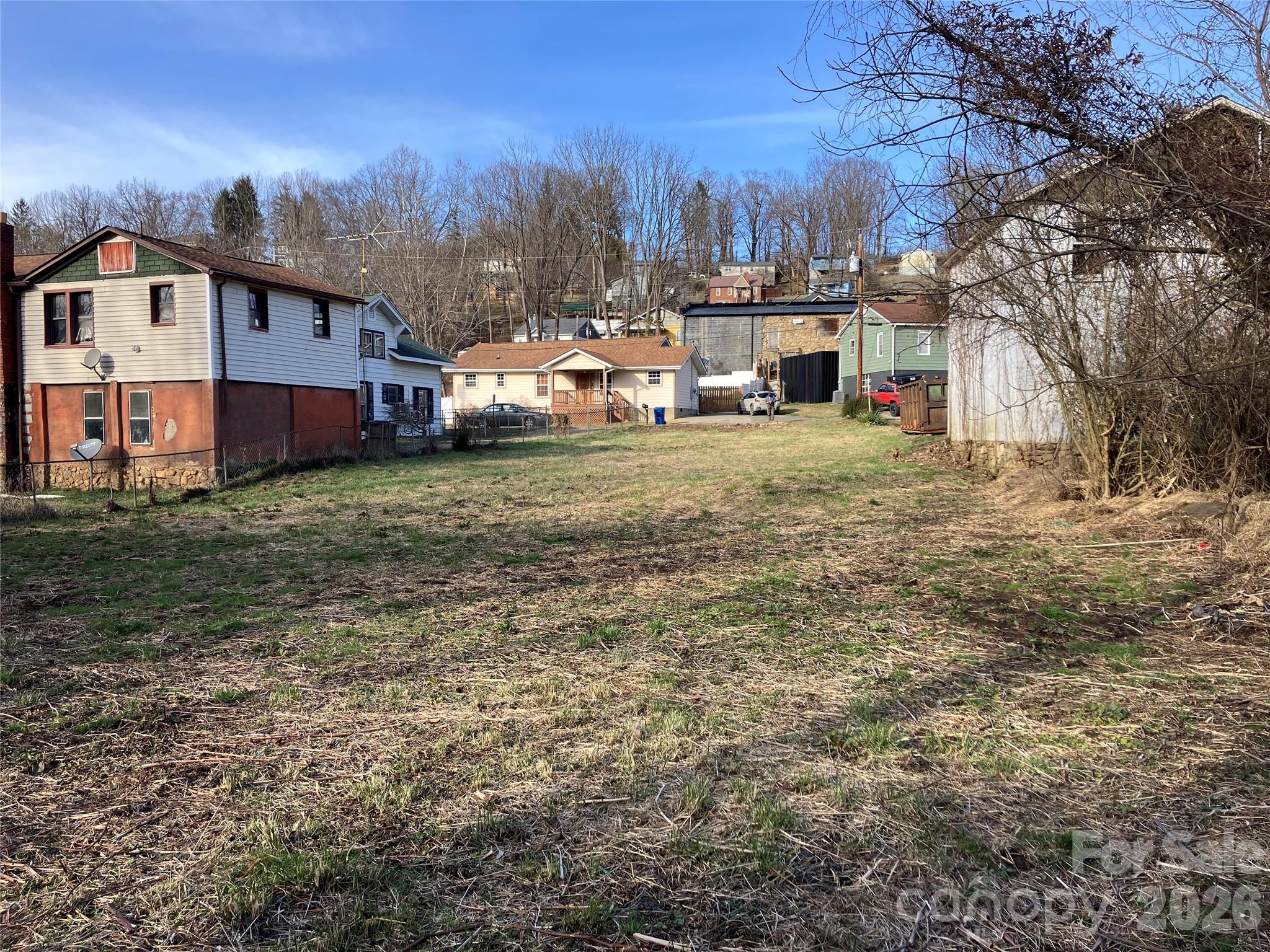 Tbd Valley Street Canton, NC 28716 - Photo 5 of 7 a view of a big house with a big yard and large trees