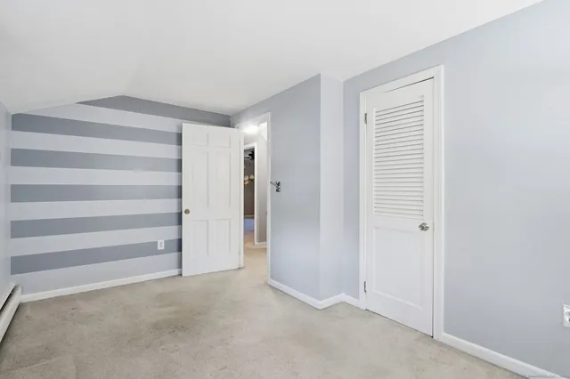 a view of closet area with empty racks