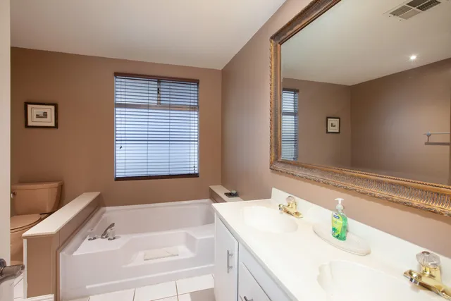 a bathroom with a sink and a window
