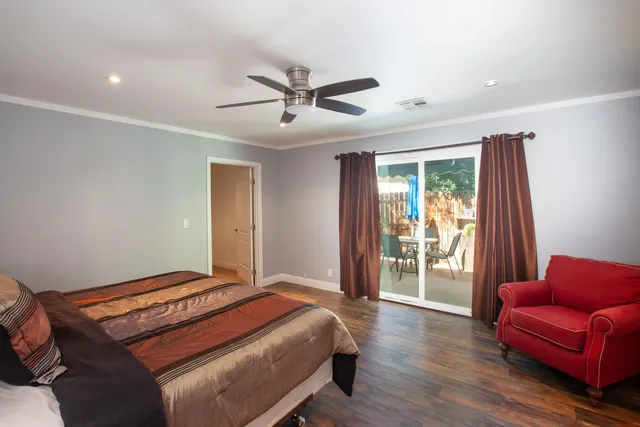 a bedroom with a bed and a couch