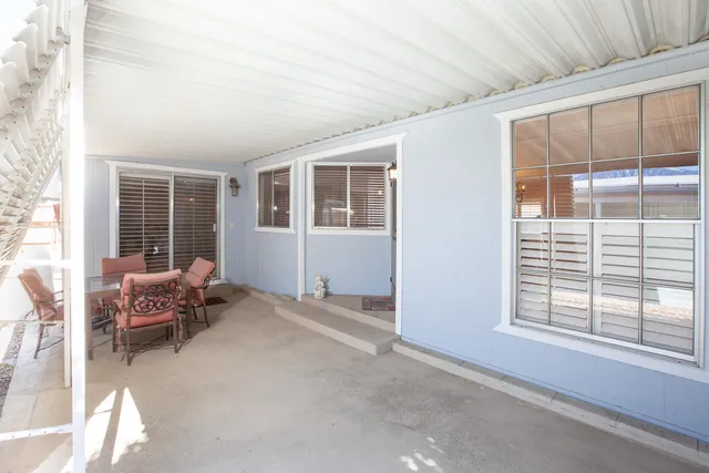 a living room with furniture and windows