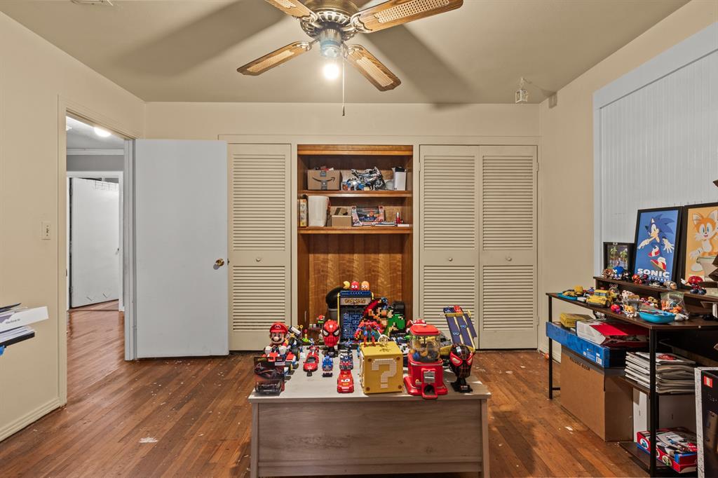 1210 East 4th Street Mount Pleasant, TX 75455 - Photo 14 of 28 a view of a dining room with furniture and chandelier