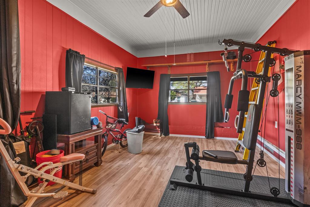 1210 East 4th Street Mount Pleasant, TX 75455 - Photo 22 of 28 a bedroom with furniture and a window