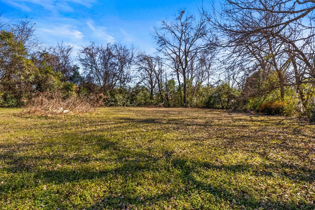 1210 East 4th Street Mount Pleasant, TX 75455 - Photo 27 of 28 a view of a yard with large trees