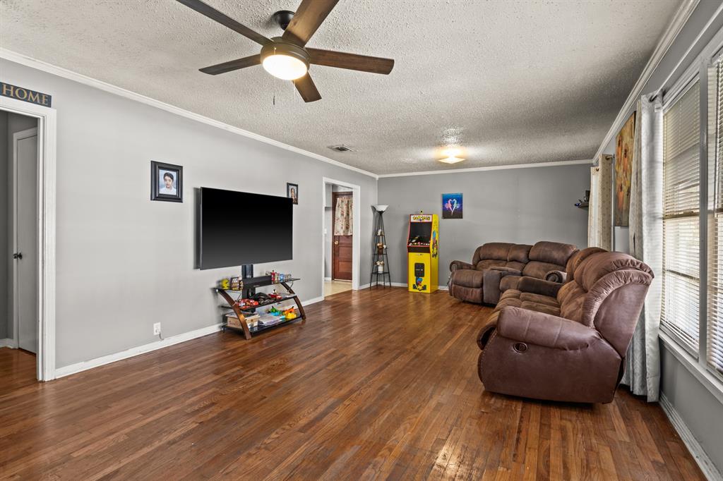 1210 East 4th Street Mount Pleasant, TX 75455 - Photo 4 of 28 a living room with furniture and a flat screen tv