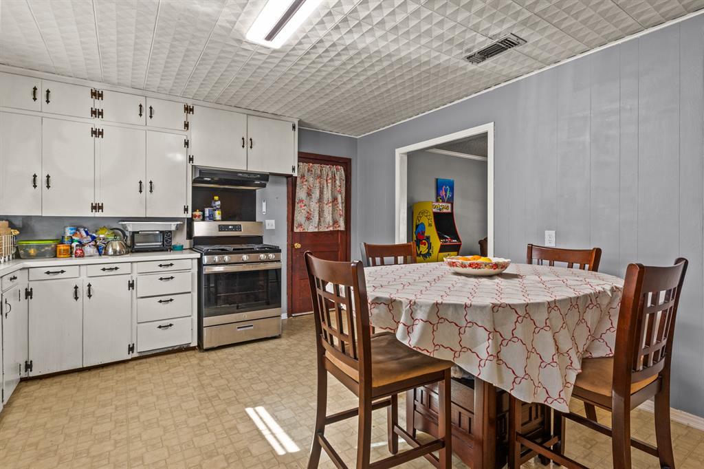 1210 East 4th Street Mount Pleasant, TX 75455 - Photo 9 of 28 a view of a dining room with furniture