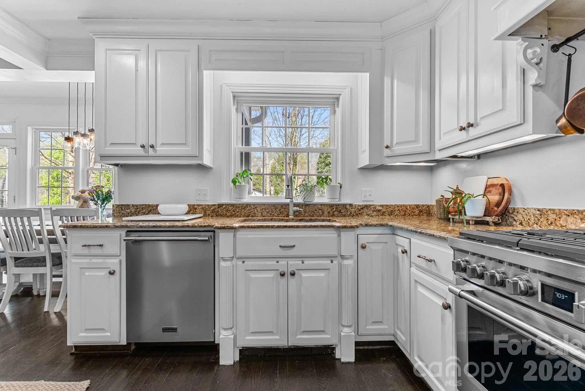 211 Dutchman Creek Road Elkin, NC 28621 - Photo 23 of 48 a kitchen with granite countertop white cabinets and white appliances