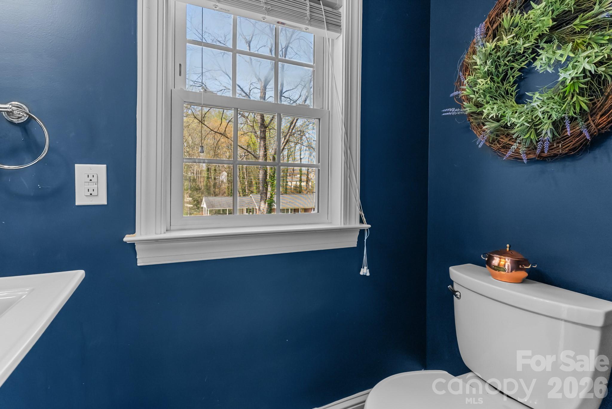211 Dutchman Creek Road Elkin, NC 28621 - Photo 25 of 48 a white toilet sitting next to a window