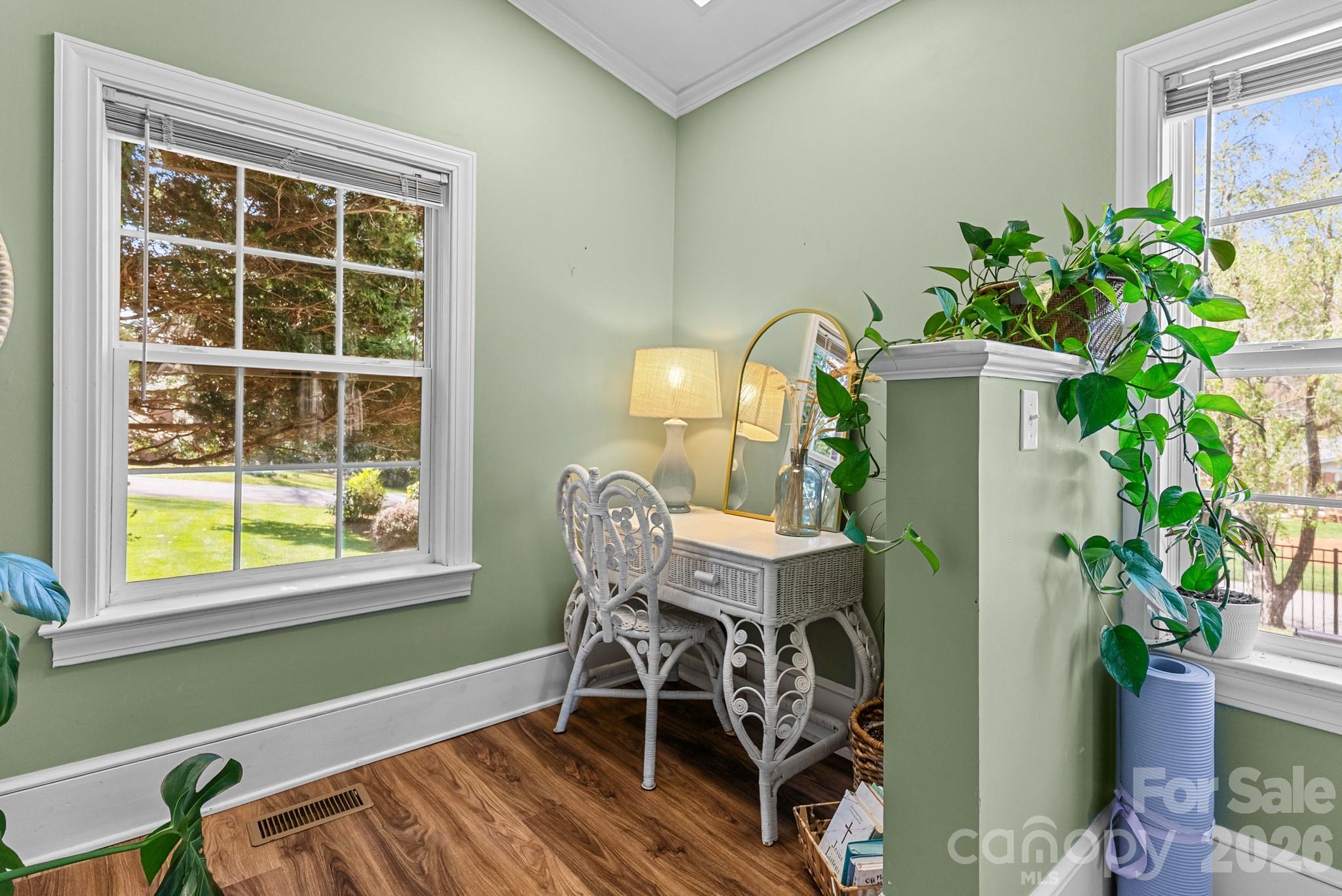 211 Dutchman Creek Road Elkin, NC 28621 - Photo 27 of 48 a dining room with furniture and a potted plant