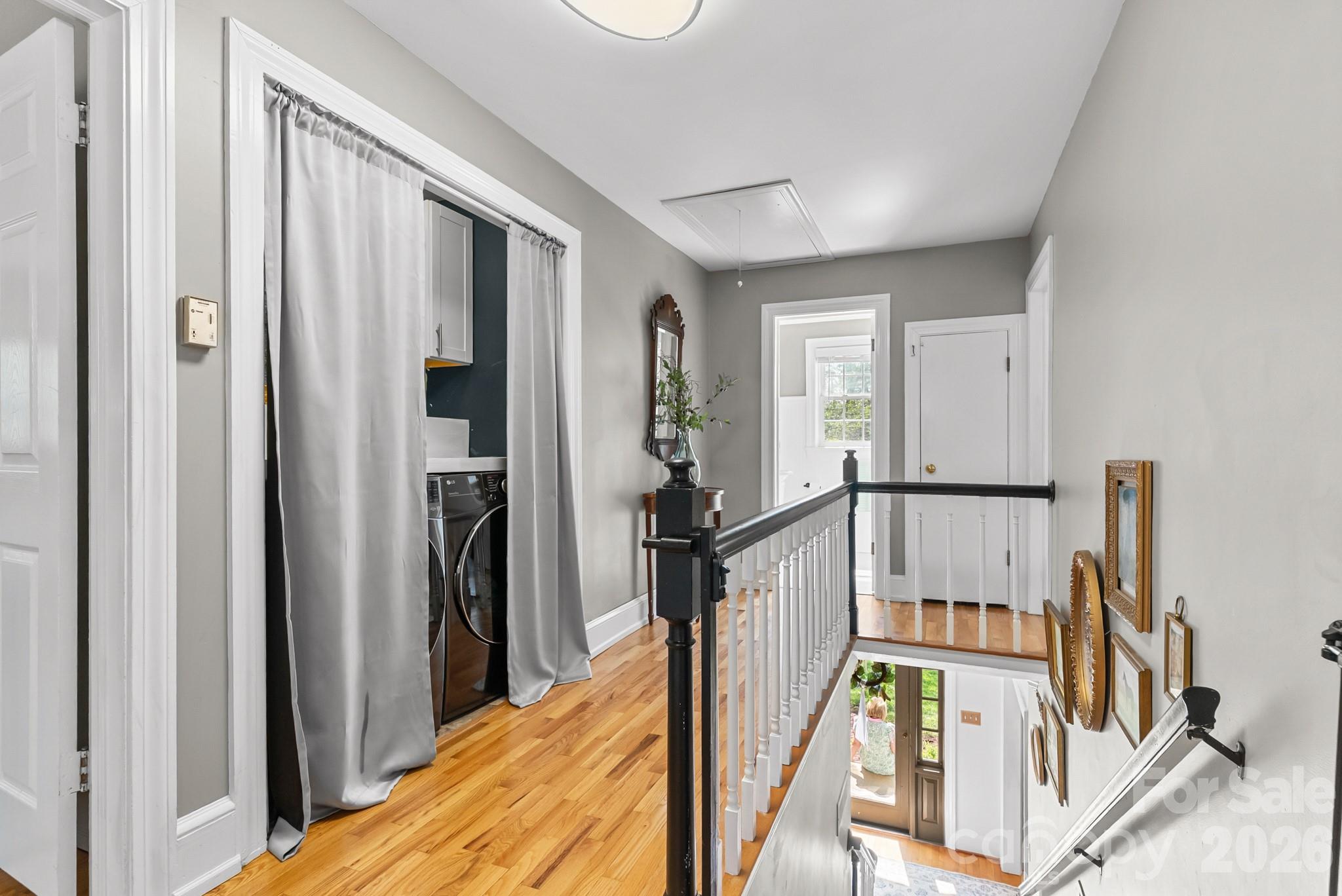 211 Dutchman Creek Road Elkin, NC 28621 - Photo 41 of 48 a view of a hallway with wooden floor and stairs