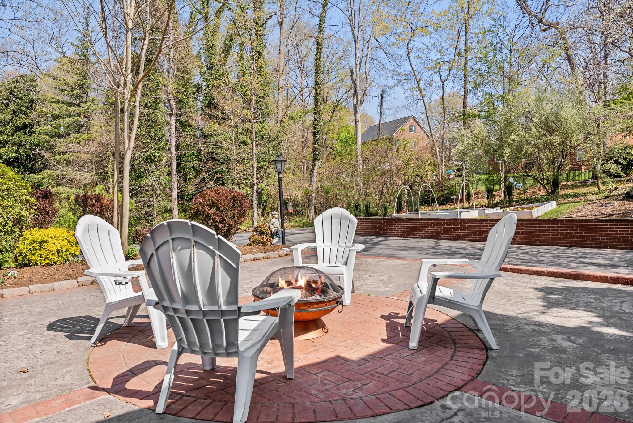 211 Dutchman Creek Road Elkin, NC 28621 - Photo 6 of 48 a view of a chairs and table in backyard