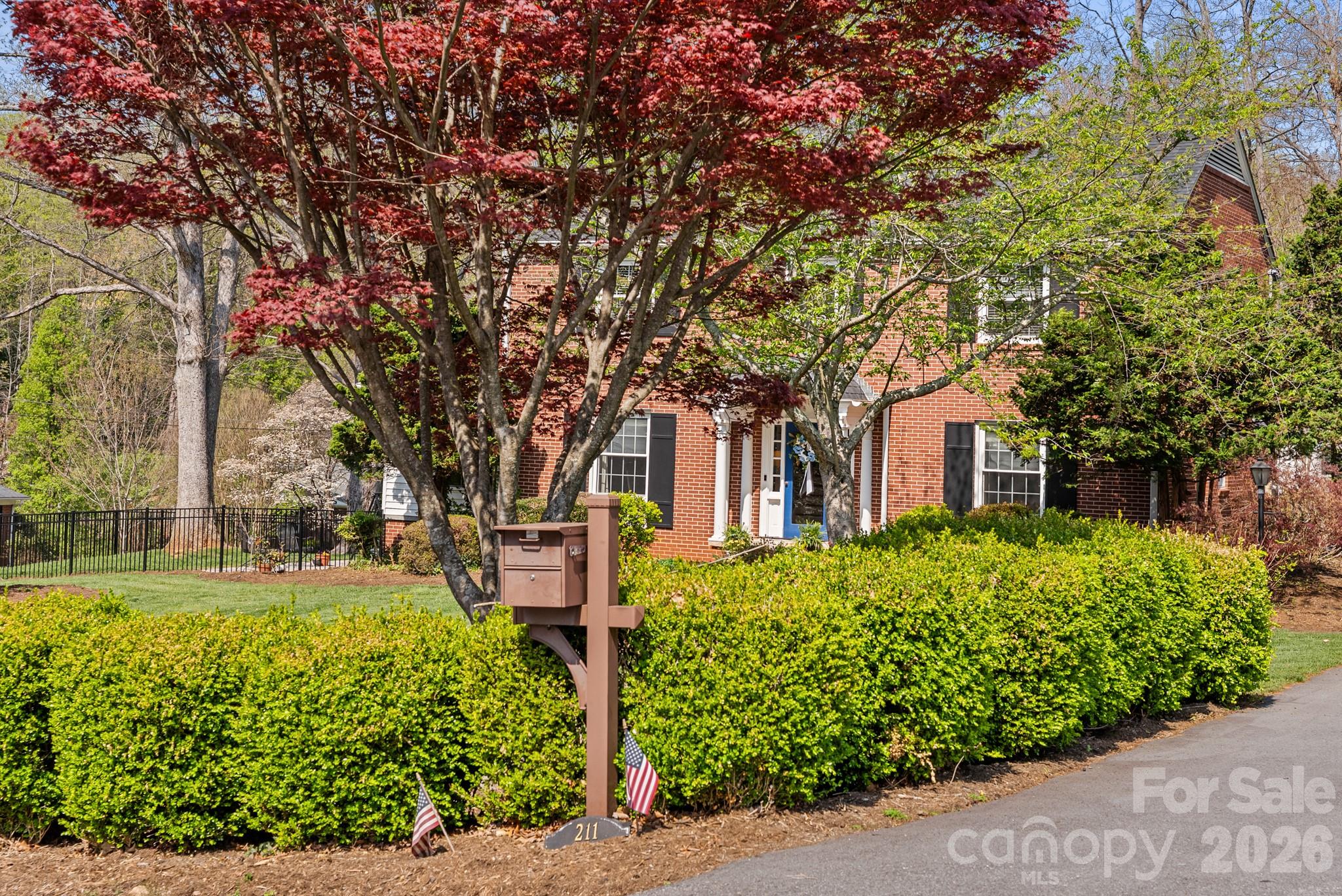 211 Dutchman Creek Road Elkin, NC 28621 - Photo 10 of 48 a front view of a house with a yard
