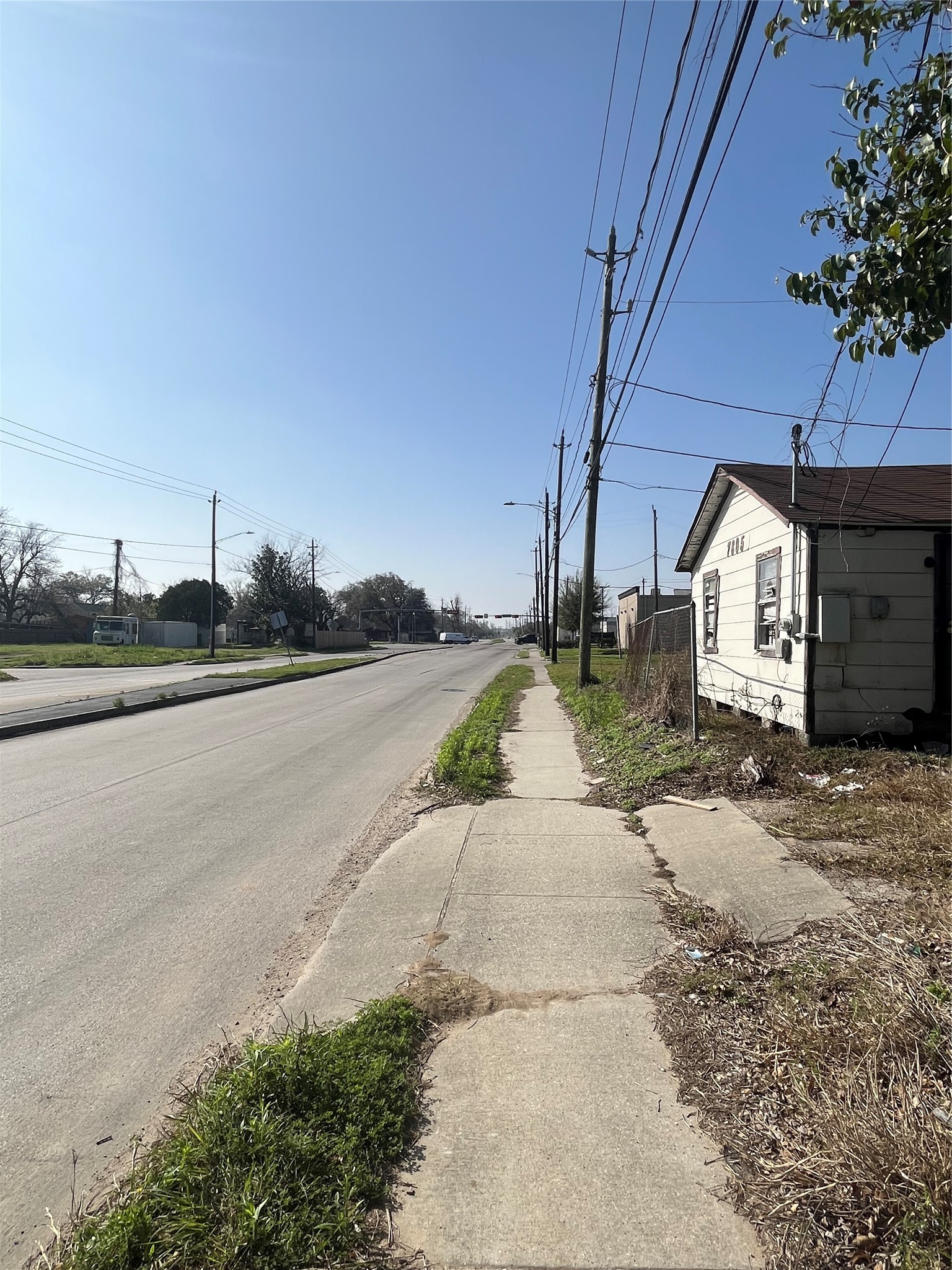 7805 Wheatley Street Houston, TX 77088 - Photo 7 of 8 a view of a street with a house