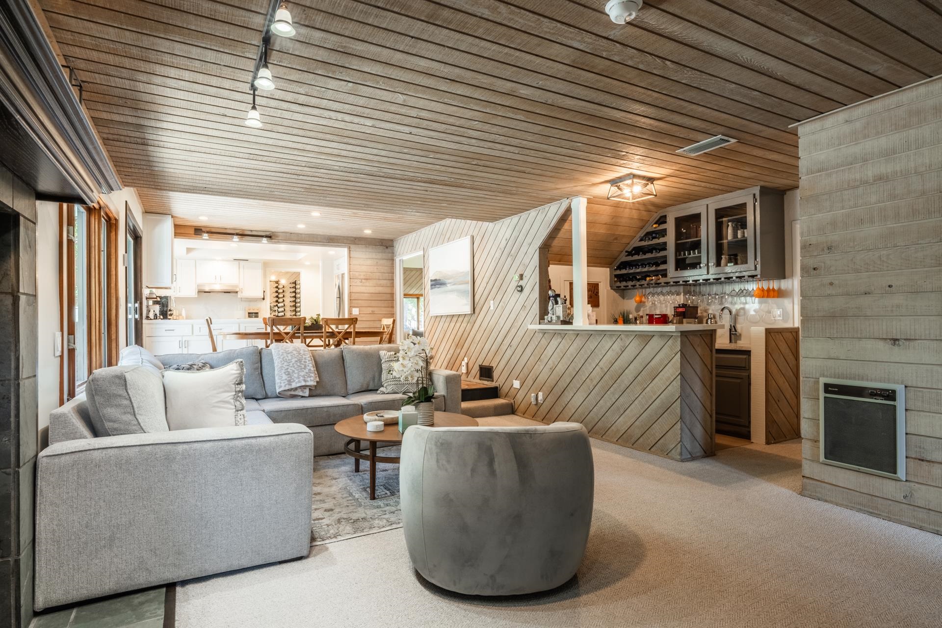274 Silver Tip Lane Mammoth Lakes, CA 93546 - Photo 23 of 52 a living room with furniture kitchen view and a fireplace