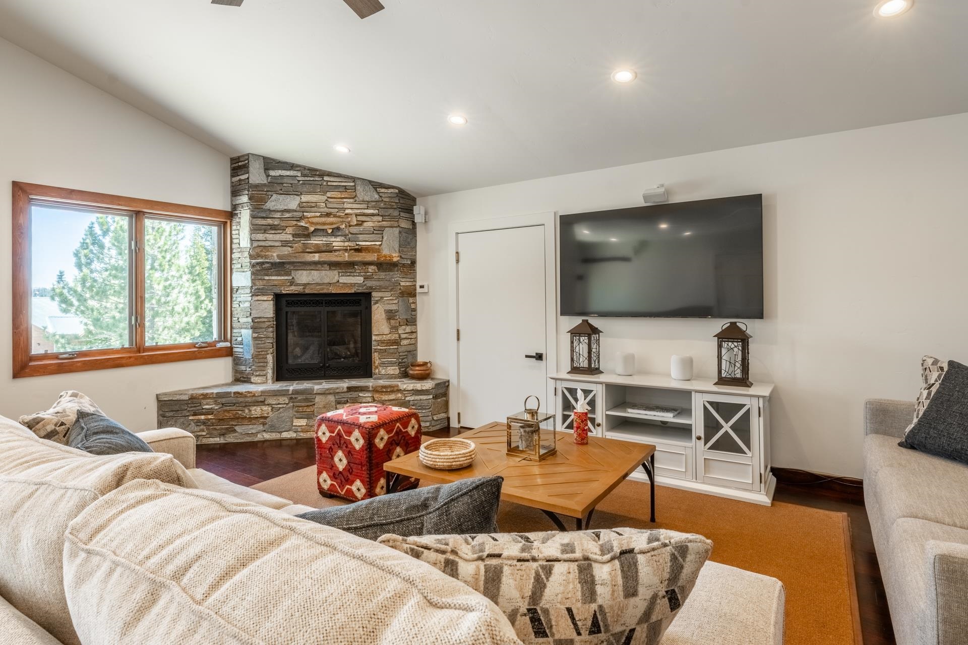 274 Silver Tip Lane Mammoth Lakes, CA 93546 - Photo 32 of 52 a living room with furniture a flat screen tv and a fireplace
