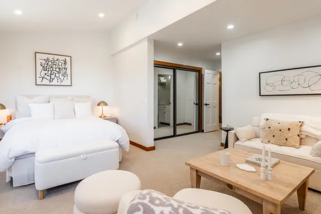 a bathroom with a sink a large mirror and a shower