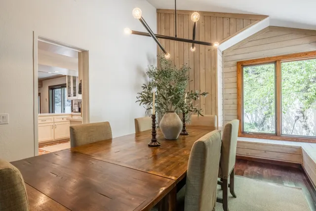 a dining room with furniture and window