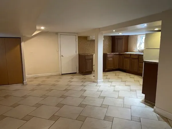 a view of a livingroom with kitchen and furniture