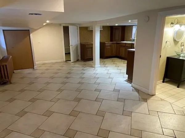 a bathroom with a toilet and a mirror