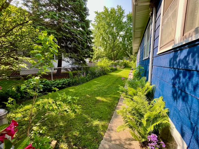 a backyard of a house with lots of green space