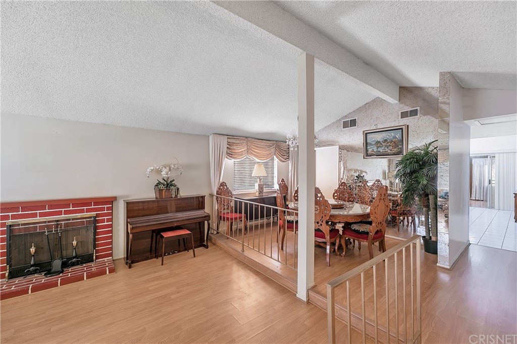 9689 Kewen Avenue Arleta, CA 91331 - Photo 2 of 28 a view of a livingroom with furniture and hardwood floor