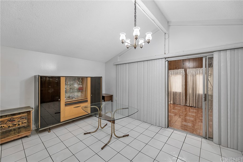 9689 Kewen Avenue Arleta, CA 91331 - Photo 11 of 28 a view of a livingroom with furniture and chandelier