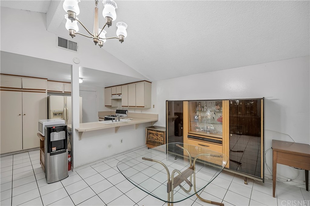 9689 Kewen Avenue Arleta, CA 91331 - Photo 12 of 28 a kitchen with granite countertop appliances cabinets and furniture