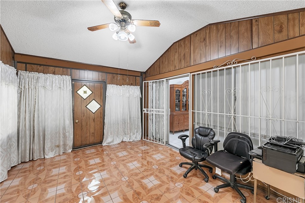 9689 Kewen Avenue Arleta, CA 91331 - Photo 14 of 28 a bedroom with furniture and a chandelier fan