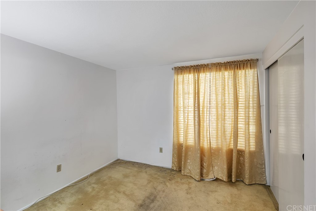 9689 Kewen Avenue Arleta, CA 91331 - Photo 19 of 28 a view of an empty room with a window