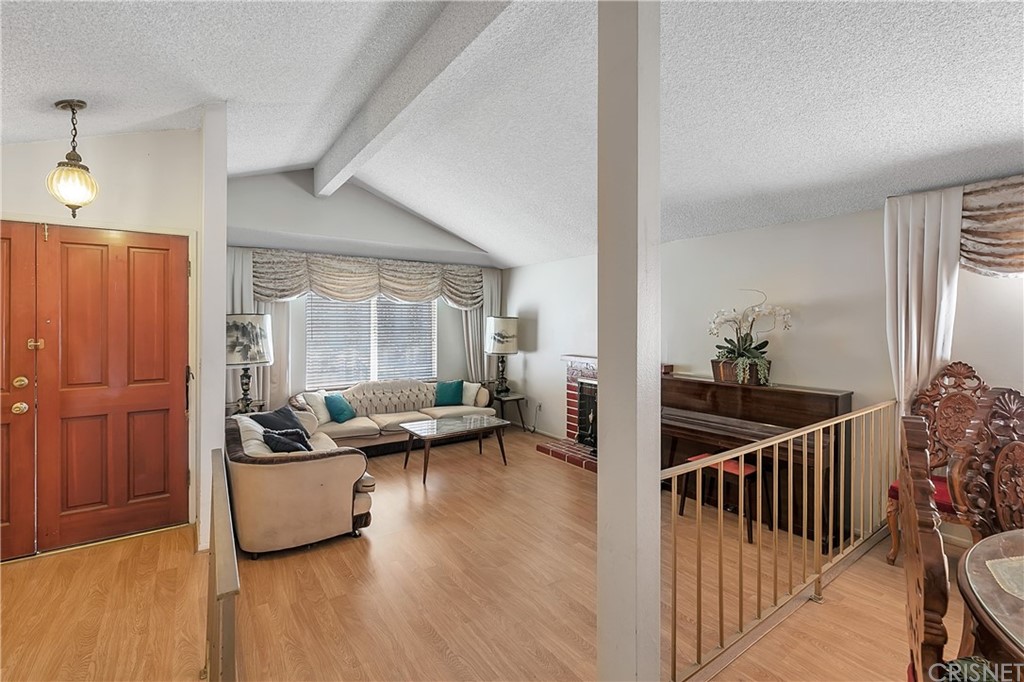 9689 Kewen Avenue Arleta, CA 91331 - Photo 3 of 28 a living room with furniture and a window