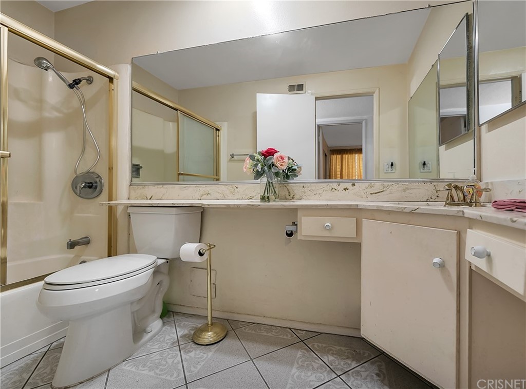 9689 Kewen Avenue Arleta, CA 91331 - Photo 22 of 28 a bathroom with a sink toilet and shower