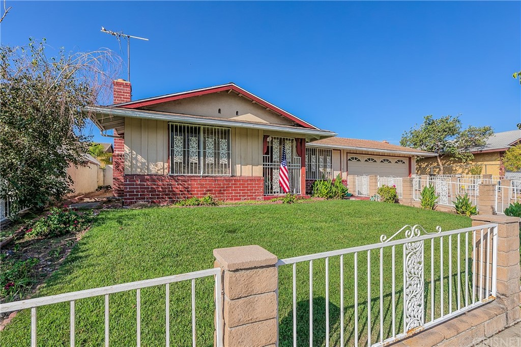 9689 Kewen Avenue Arleta, CA 91331 - Photo 27 of 28 a front view of a house with a yard