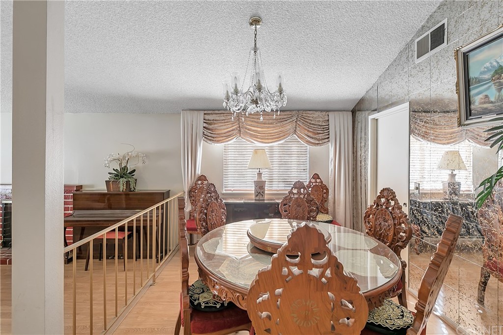 9689 Kewen Avenue Arleta, CA 91331 - Photo 5 of 28 a view of a dining room with furniture window and wooden floor