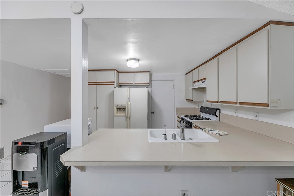 9689 Kewen Avenue Arleta, CA 91331 - Photo 10 of 28 a bathroom with a sink and a mirror