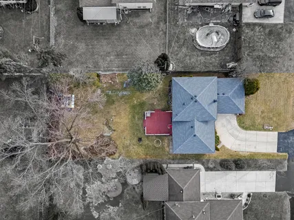 an aerial view of residential houses with outdoor space