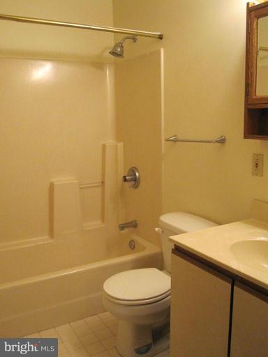 10473 Tetotum Road King George, VA 22485 - Photo 17 of 23 a bathroom with a sink a toilet and shower