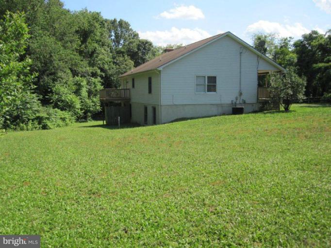 10473 Tetotum Road King George, VA 22485 - Photo 3 of 23 a view of a backyard with potted plants and large tree