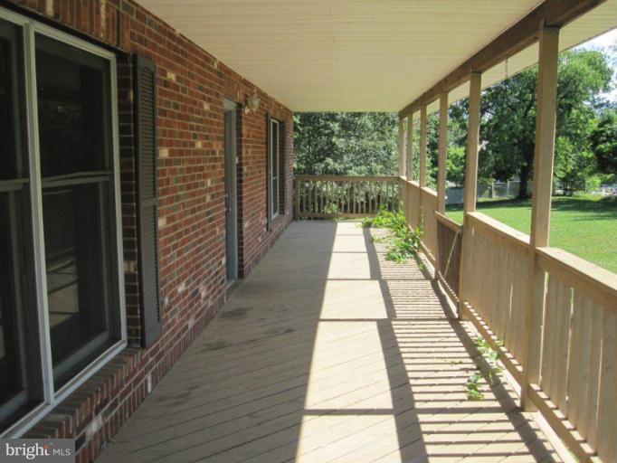 10473 Tetotum Road King George, VA 22485 - Photo 6 of 23 a view of balcony with wooden floor