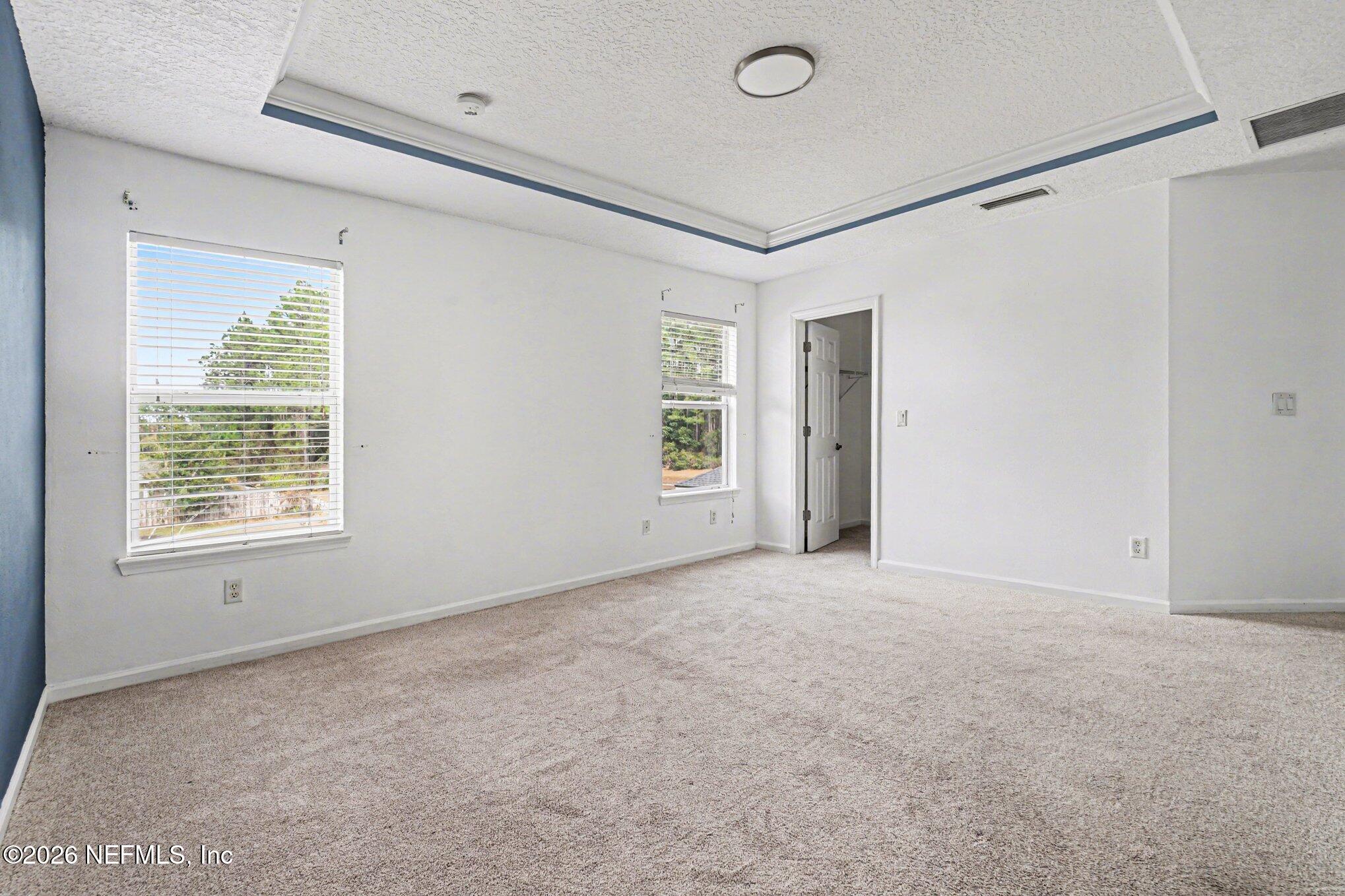 96039 Morton Lane Yulee, FL 32097 - Photo 11 of 27 an empty room with windows and closet