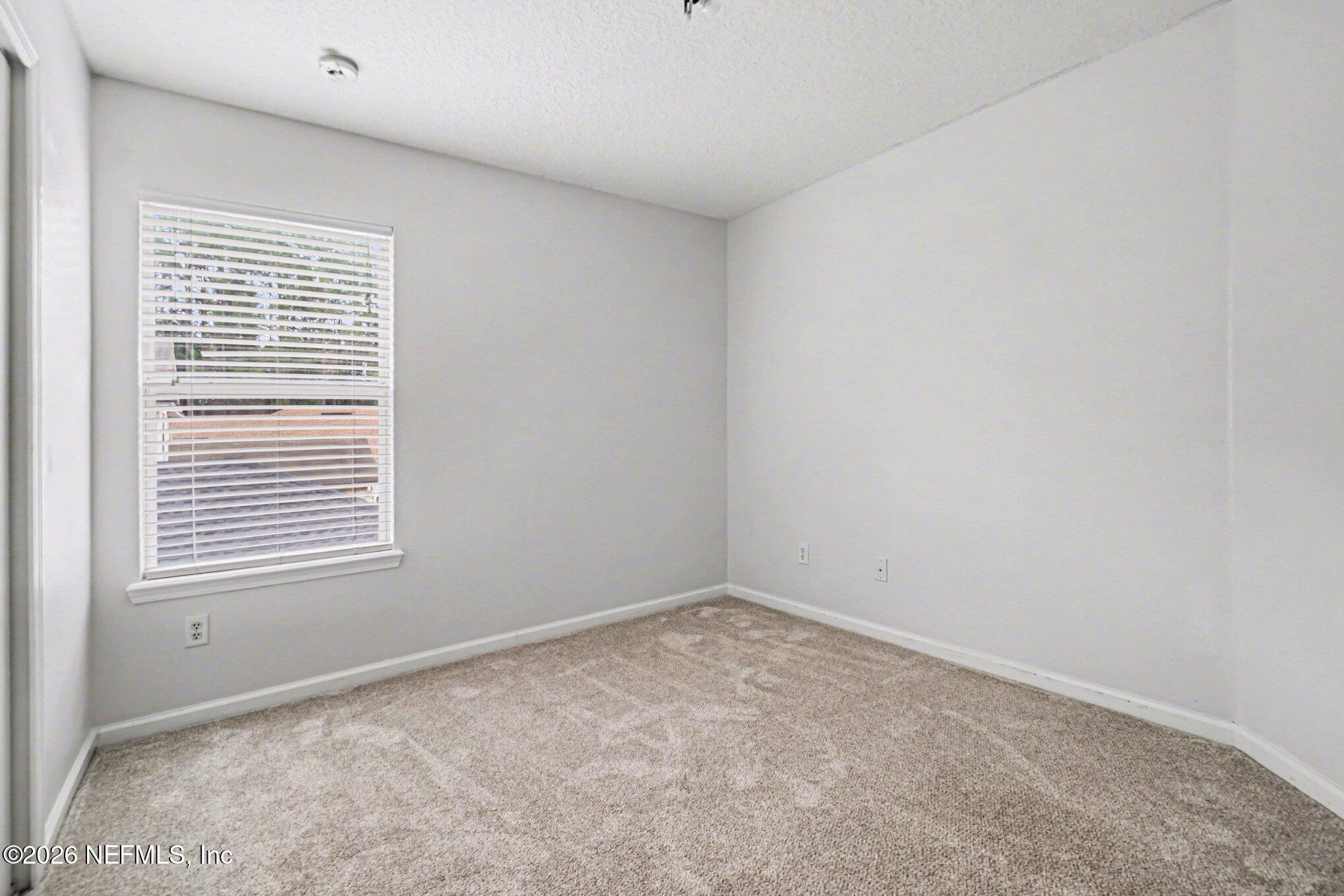 96039 Morton Lane Yulee, FL 32097 - Photo 19 of 27 a view of an empty room with a window