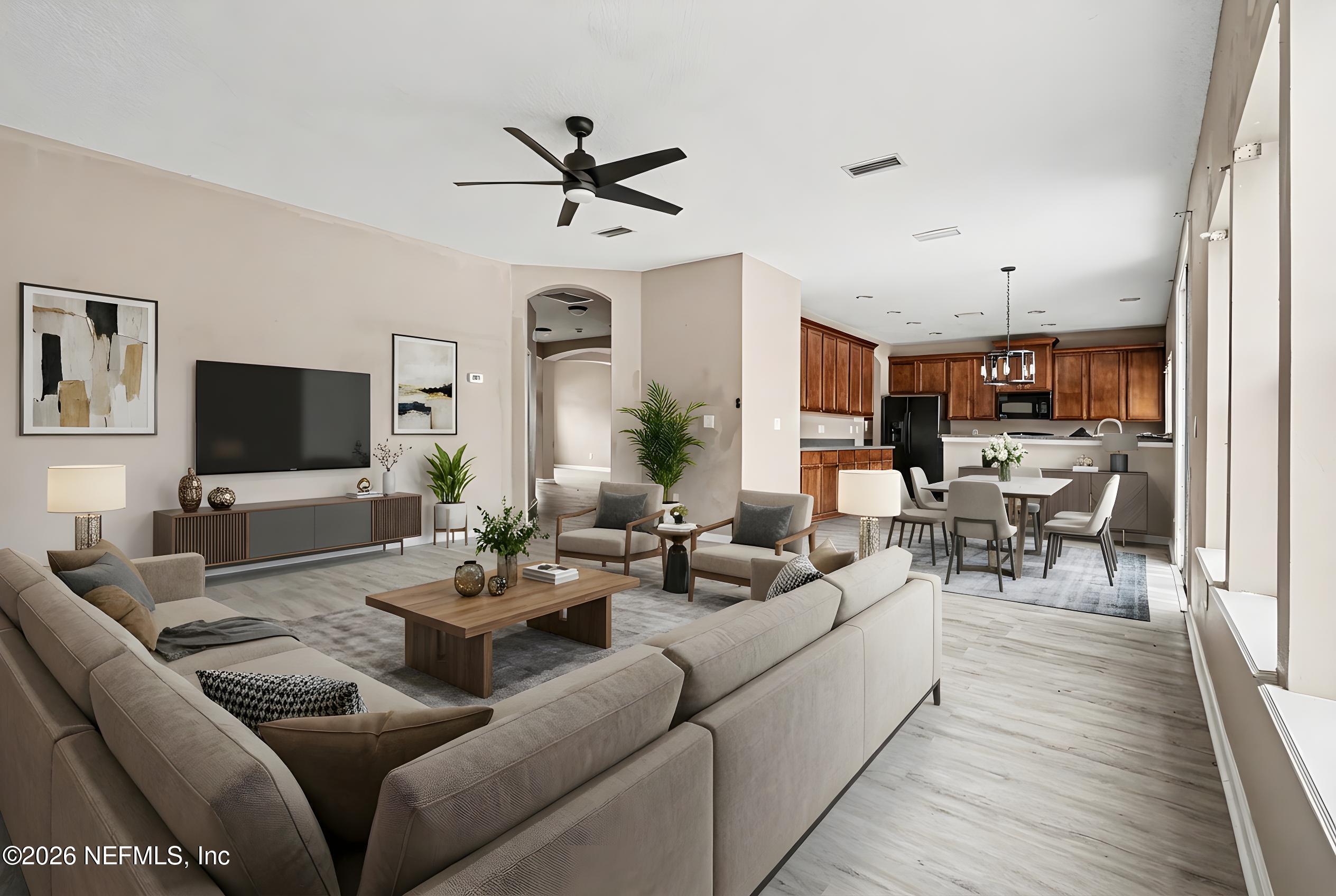 96039 Morton Lane Yulee, FL 32097 - Photo 7 of 27 a living room with furniture and a flat screen tv