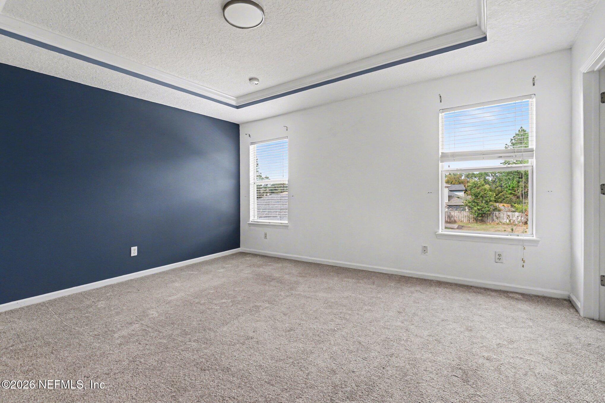 96039 Morton Lane Yulee, FL 32097 - Photo 10 of 27 an empty room with windows and closet