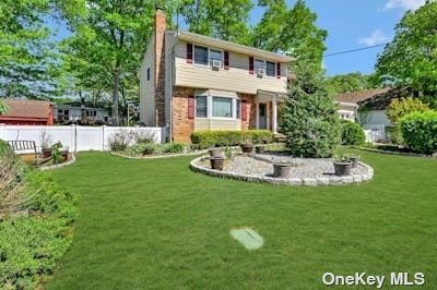 a view of a house with a swimming pool and a yard