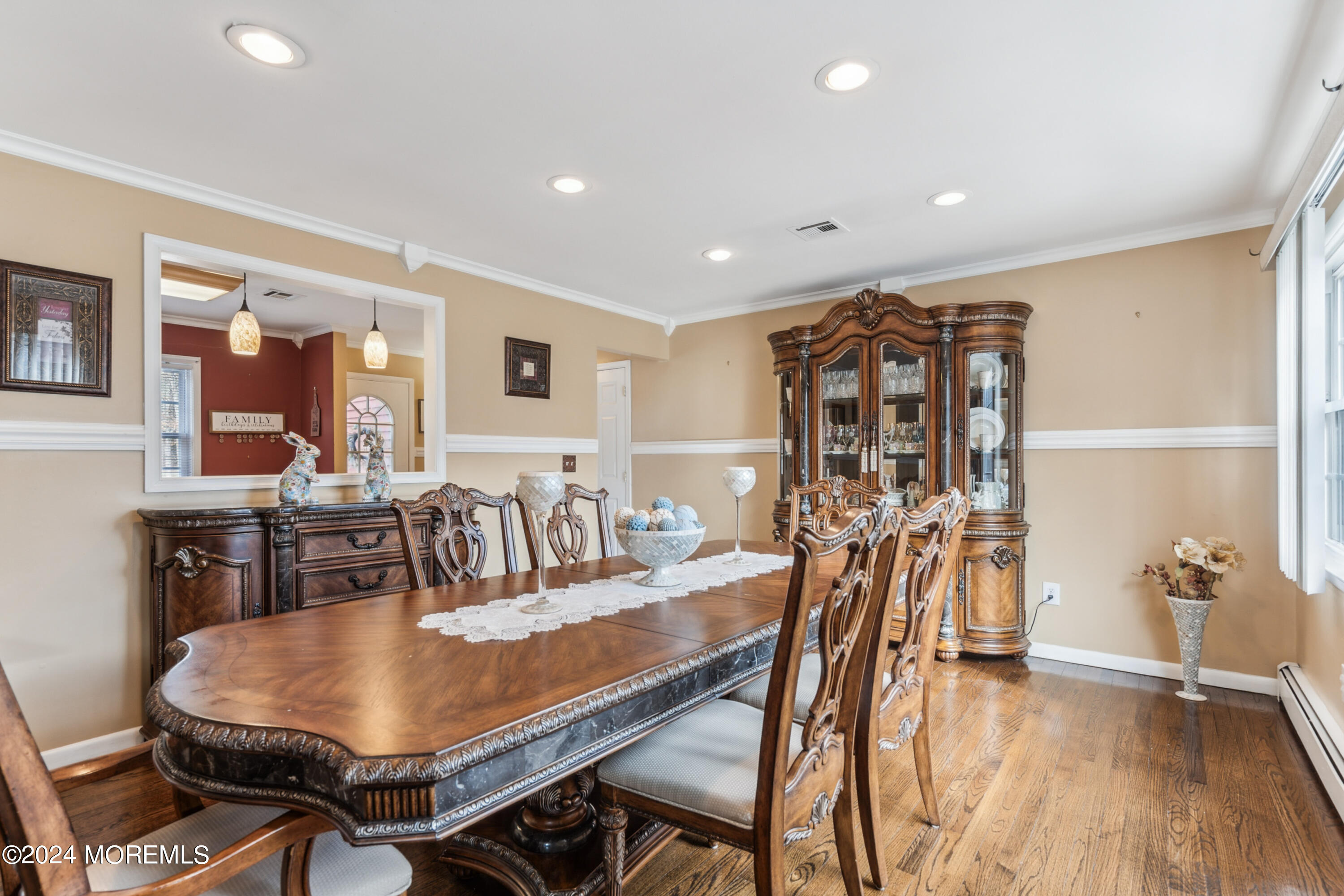 112 Porter Road Howell, NJ 07731 - Photo 12 of 39 a dining room with furniture and wooden floor