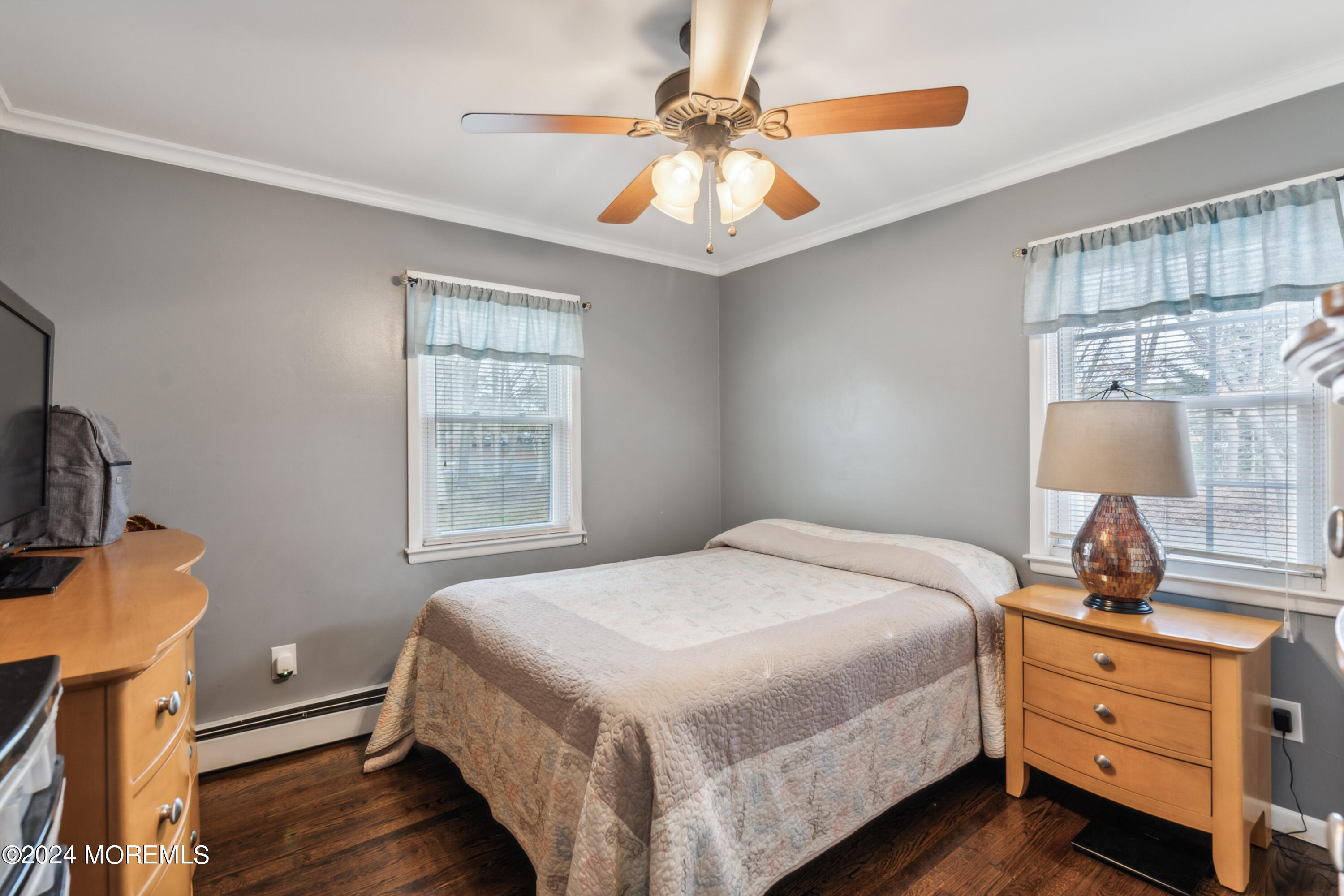 112 Porter Road Howell, NJ 07731 - Photo 14 of 39 a bedroom with a bed and a chandelier fan