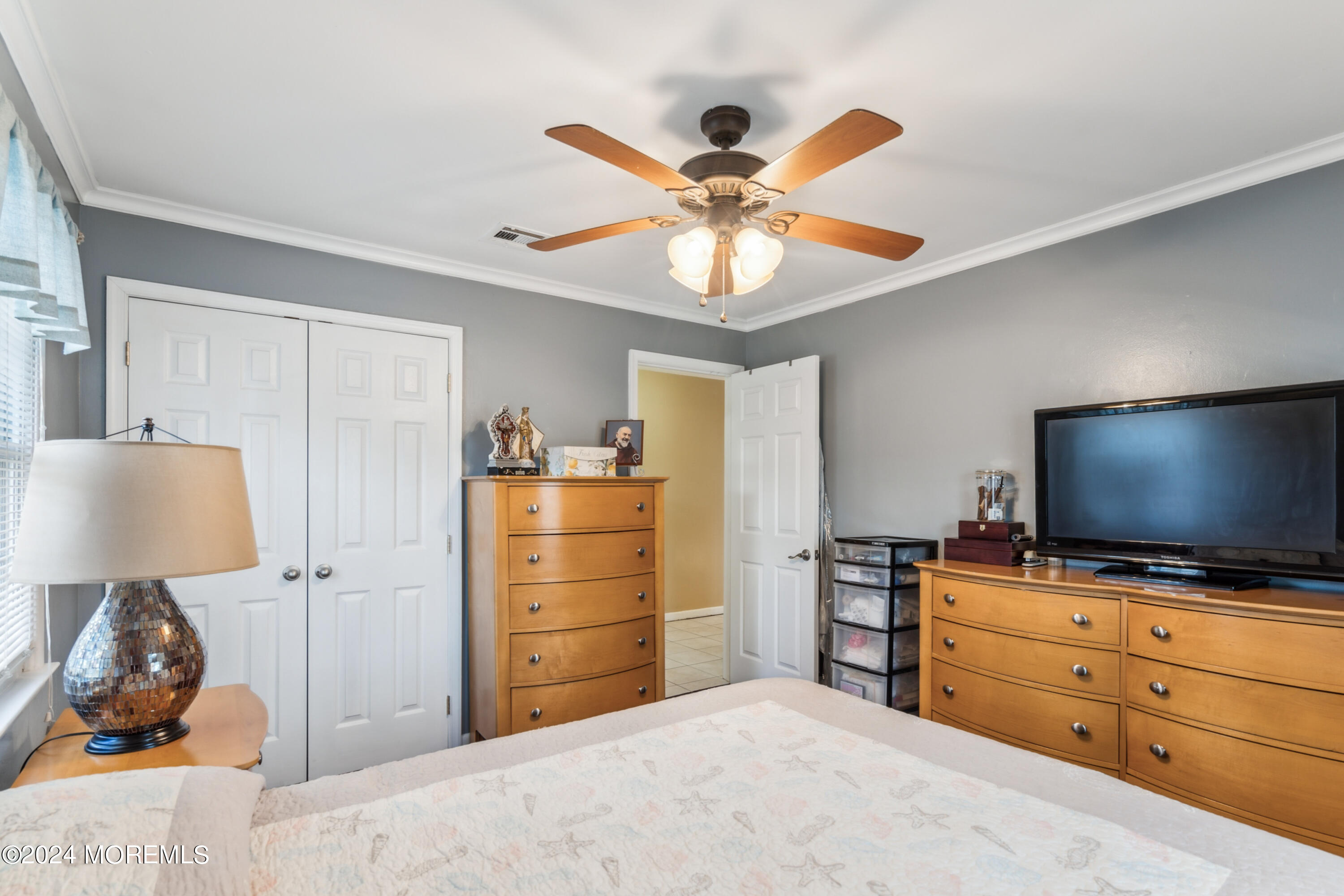 112 Porter Road Howell, NJ 07731 - Photo 15 of 39 a bedroom with a bed and a flat screen tv