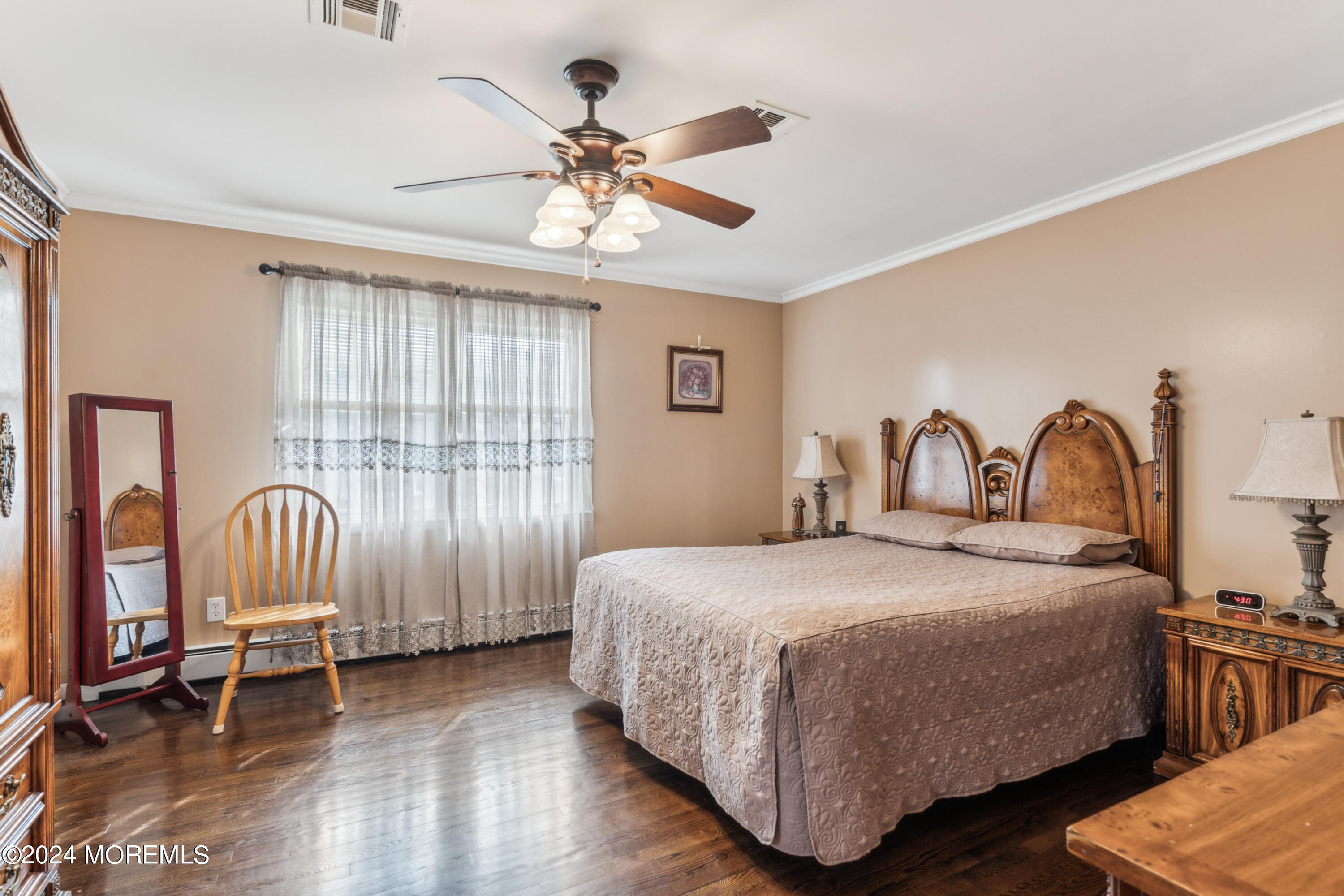 112 Porter Road Howell, NJ 07731 - Photo 17 of 39 a bedroom with a bed a chandelier with a dresser