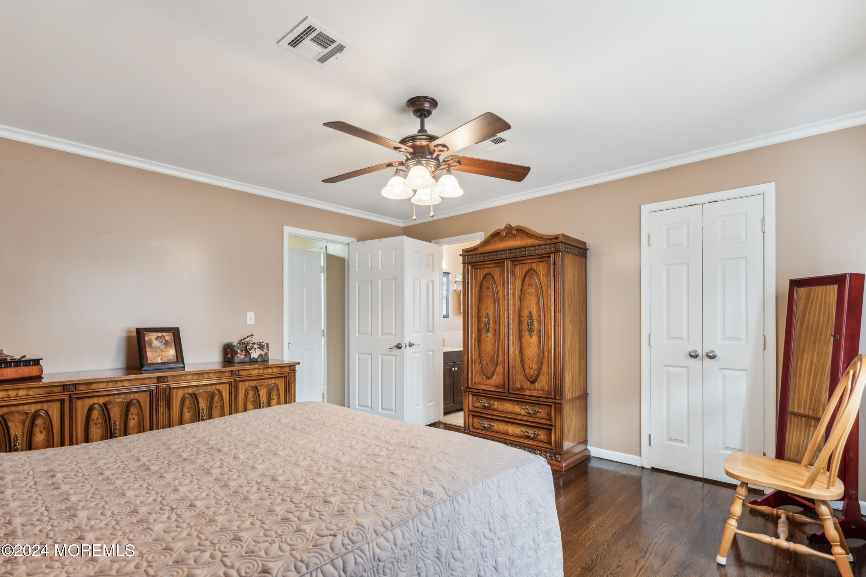 112 Porter Road Howell, NJ 07731 - Photo 18 of 39 a bedroom with a bed and a chandelier