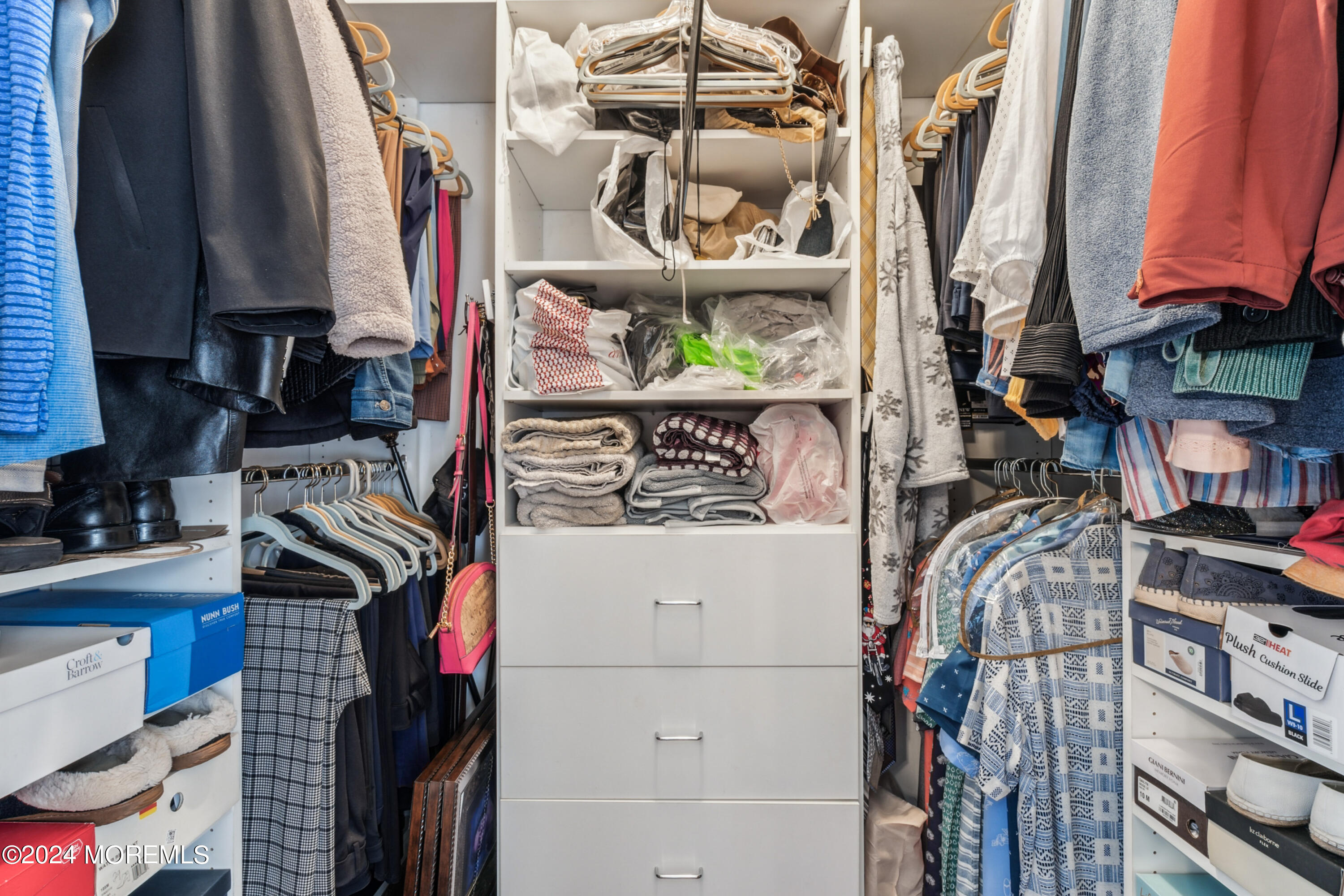 112 Porter Road Howell, NJ 07731 - Photo 20 of 39 a view of walk in closet with clothes and shoes